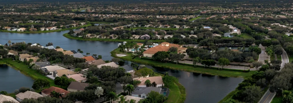 Aerial view of Valencia Isles showing the clubhouse, lakes, and surrounding homes in Boynton Beach.