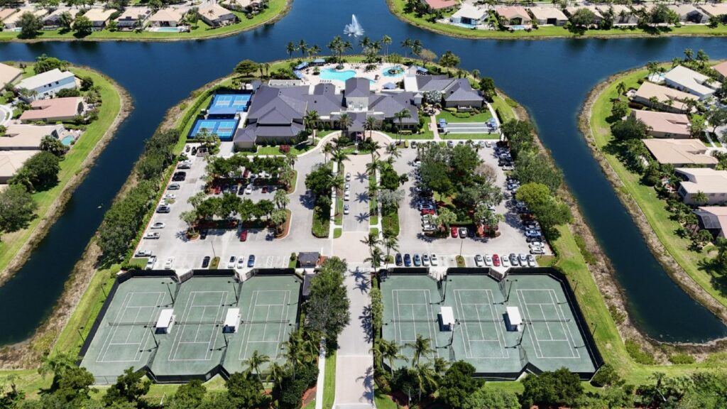 Aerial view of Valencia Pointe tennis courts, pickleball courts, clubhouse, and pools