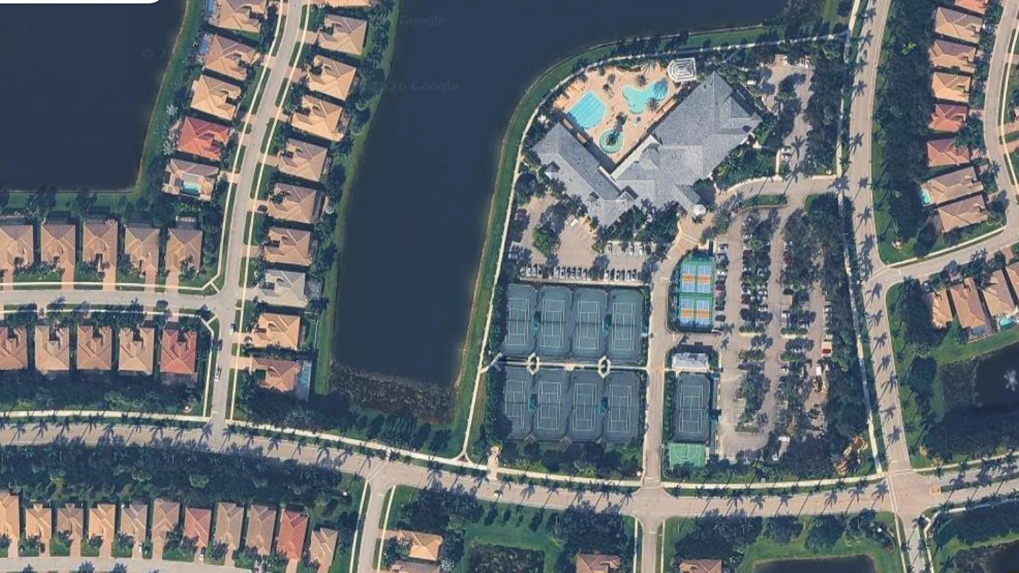 Aerial view of Valencia Reserve clubhouse, tennis courts and resort amenities in Boynton Beach