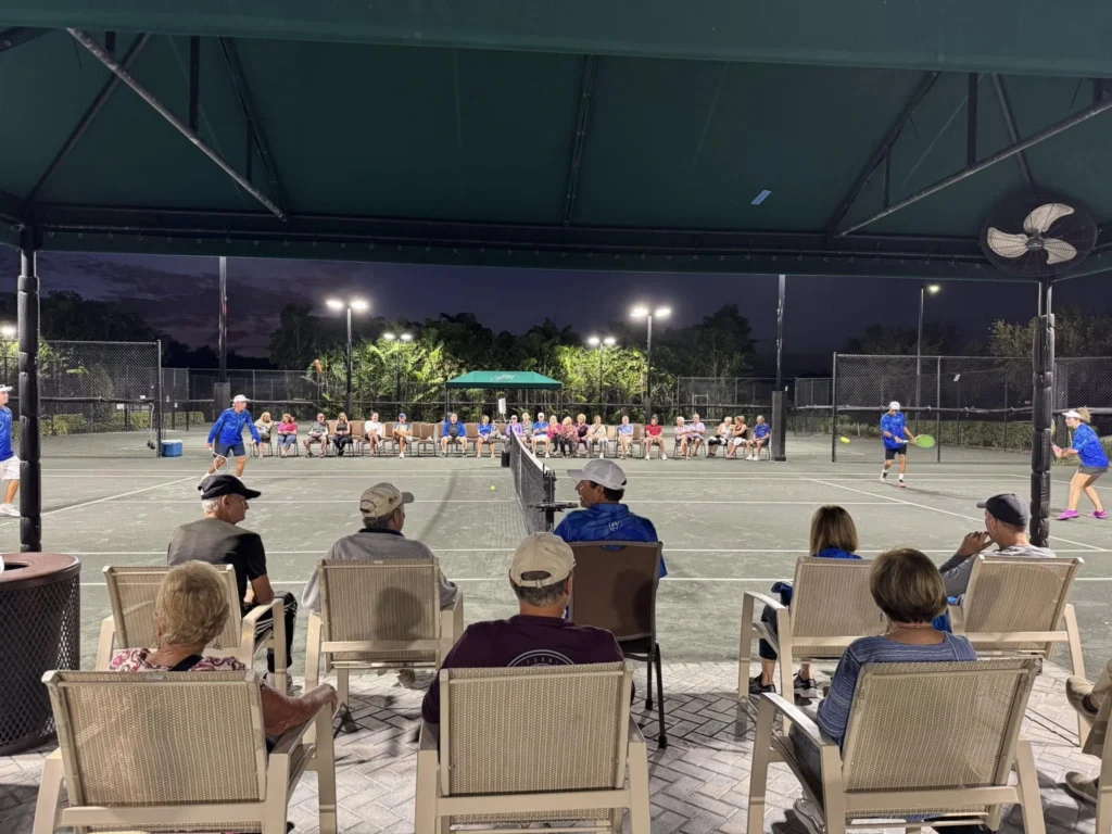 Residents gathering for an evening tennis social at Valencia Reserve