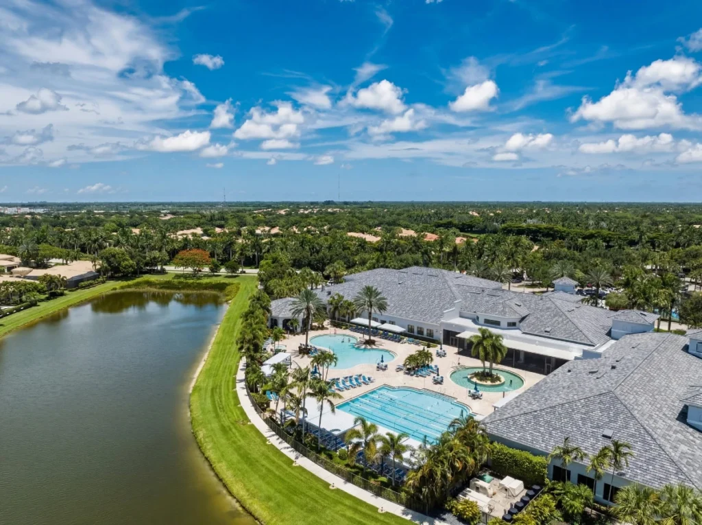 Resort-style swimming pools and clubhouse overlooking the lake at Valencia Reserve